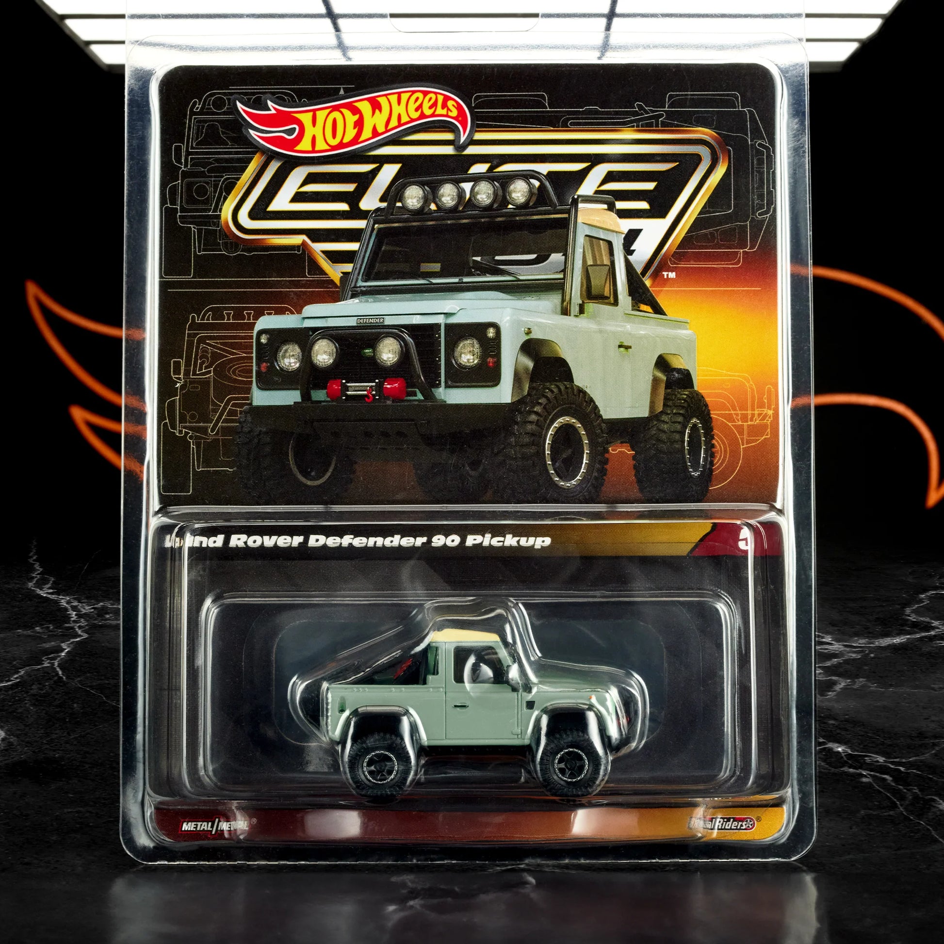 Hot Wheels 1:64 scale Elite 64 die-cast model of the Land Rover Defender 90 Pickup in green-cyan with off-road detailing.